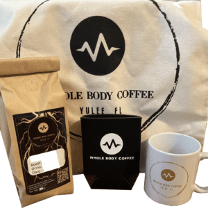 swag bag gift set including mug, bag of coffee, koozie, and reusable tote